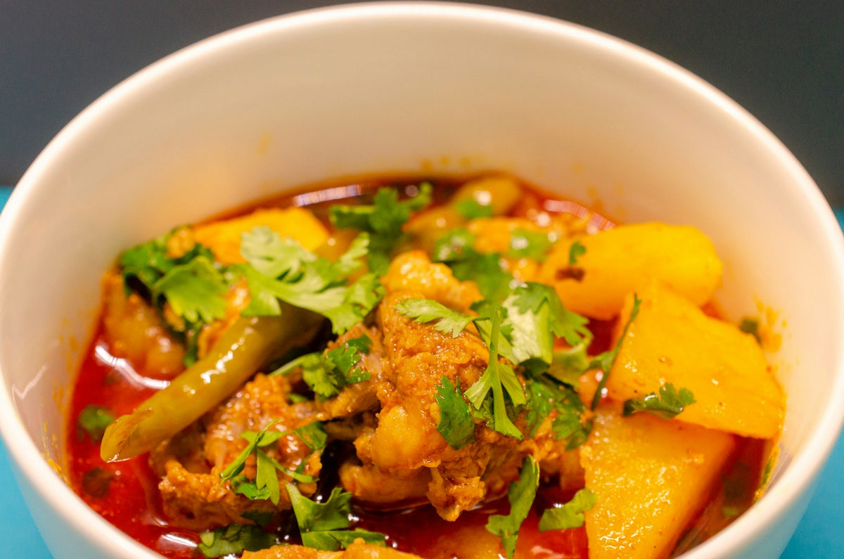 A white bowl of Pakistani meat and vegetable curry photographed in Lahore (photo: Dr Muhammad Amer, Unsplash)